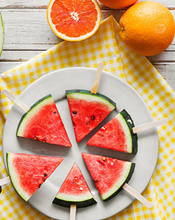 PLATE OF FRUIT OR MOM EATING FRUIT