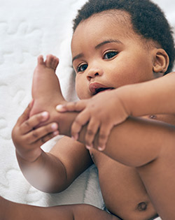 BABY HOLDING FEET